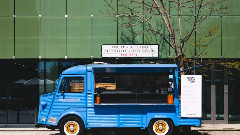 Food truck parked at a service location with menu board